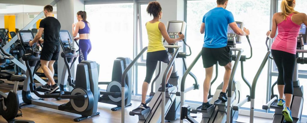 people on fitness treadmills