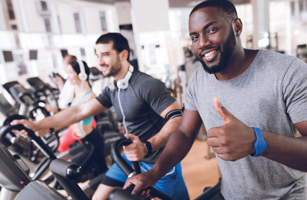 men on health club treadmill